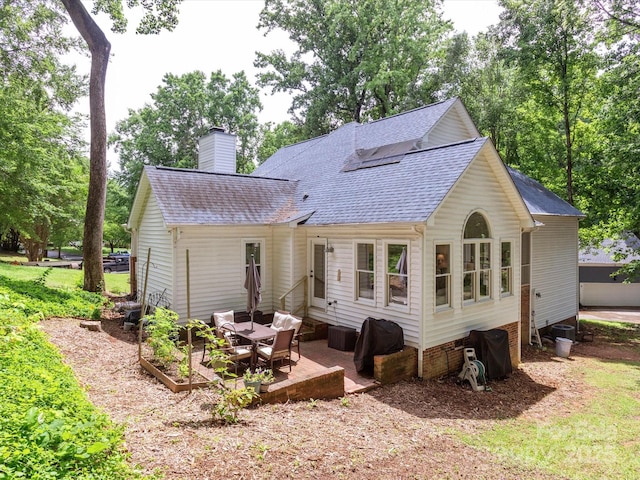 6934 Loretta Pl, Charlotte, NC 28215 - back of house with roof with shingles, a chimney, and a patio area