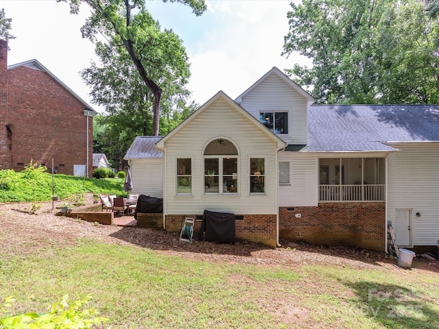 6934 Loretta Pl, Charlotte, NC 28215 - rear view of property featuring a lawn, crawl space, roof with shingles, and a patio area