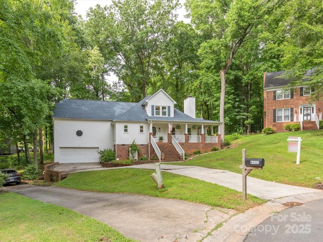 6934 Loretta Pl, Charlotte, NC 28215 - view of front of property featuring covered porch, a chimney, stairs, driveway, and a garage