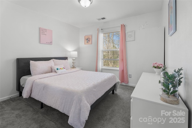 3735 Ernie Dr, Charlotte, NC 28269 - carpeted bedroom featuring baseboards