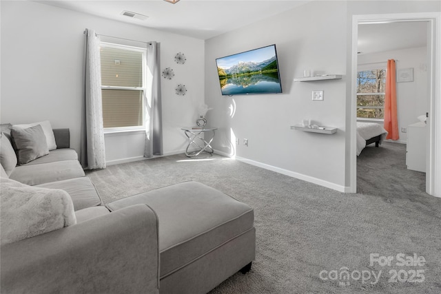 3735 Ernie Dr, Charlotte, NC 28269 - carpeted living area featuring baseboards