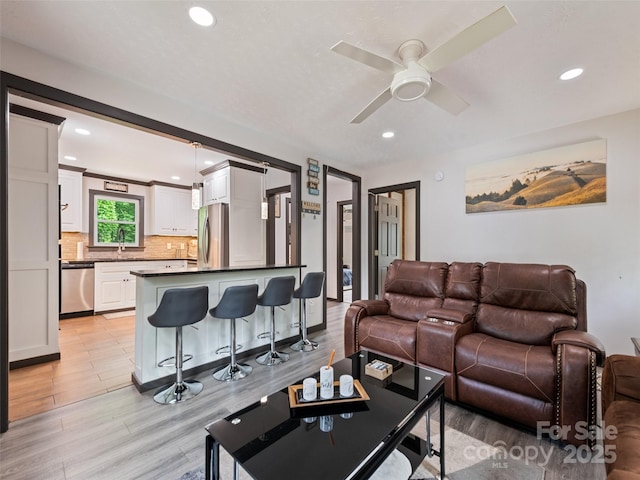 229 Yellow Bird Branch Rd, Sylva, NC 28779 - living room featuring light wood-style flooring, recessed lighting, and ceiling fan