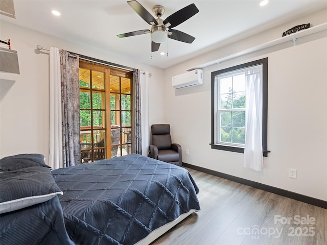 229 Yellow Bird Branch Rd, Sylva, NC 28779 - bedroom with an AC wall unit, wood finished floors, recessed lighting, and a ceiling fan
