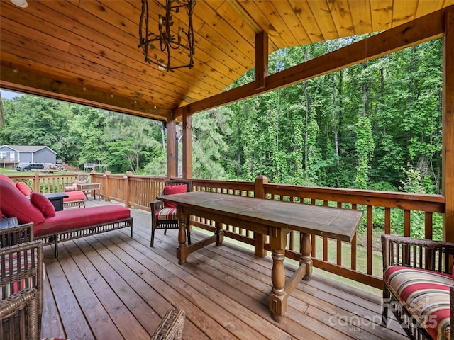 229 Yellow Bird Branch Rd, Sylva, NC 28779 - deck with a wooded view, outdoor dining space, and an outdoor hangout area