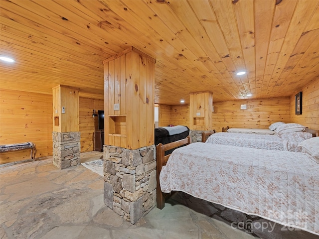 229 Yellow Bird Branch Rd, Sylva, NC 28779 - bedroom featuring wooden ceiling, stone finish floors, recessed lighting, and wood walls
