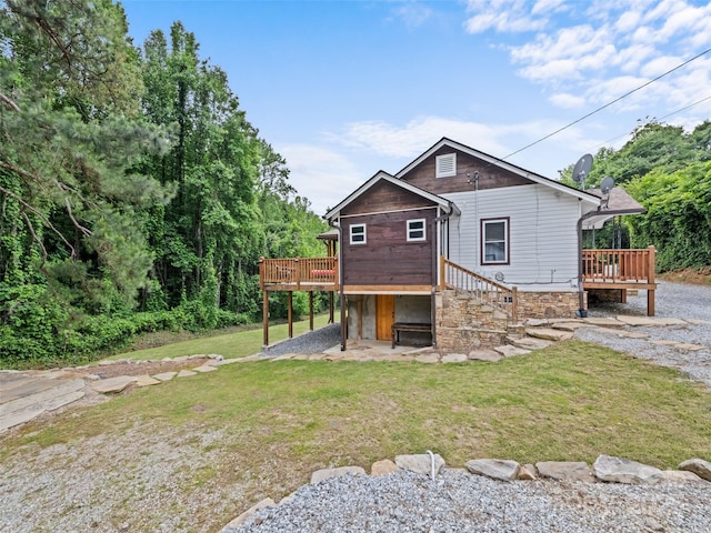 229 Yellow Bird Branch Rd, Sylva, NC 28779 - rear view of property featuring a deck, a lawn, a patio, and stone siding