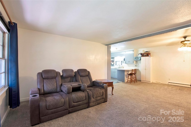 1145 Craigbrow Cir, Chester, SC 29706 - carpeted home theater room featuring a ceiling fan and a baseboard radiator