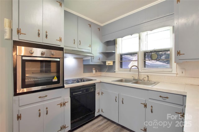 1145 Craigbrow Cir, Chester, SC 29706 - kitchen featuring black appliances, crown molding, under cabinet range hood, light countertops, and light wood finished floors