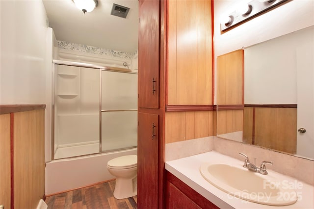 1145 Craigbrow Cir, Chester, SC 29706 - bathroom featuring vanity, wood finished floors, and enclosed tub / shower combo