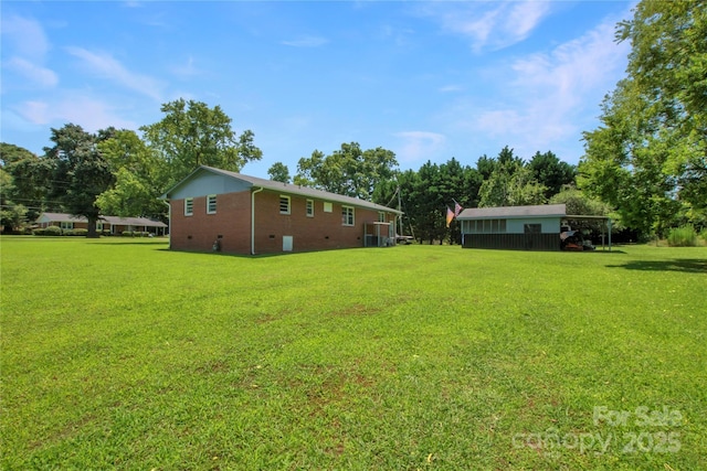 1145 Craigbrow Cir, Chester, SC 29706 - view of green lawn featuring a carport and view of wooded area