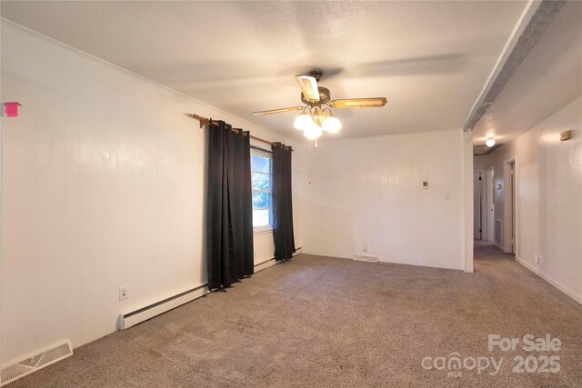 1145 Craigbrow Cir, Chester, SC 29706 - empty room with a baseboard heating unit, a ceiling fan, and carpet flooring