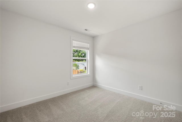 443 Faith Dr SW, Concord, NC 28027 - empty room with light carpet and baseboards