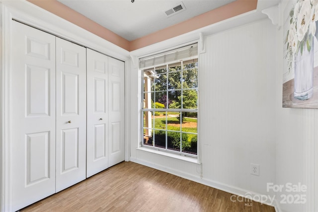 1670 Robins Nest Ct Unit D, Gastonia, NC 28054 - unfurnished bedroom with light wood finished floors and a closet