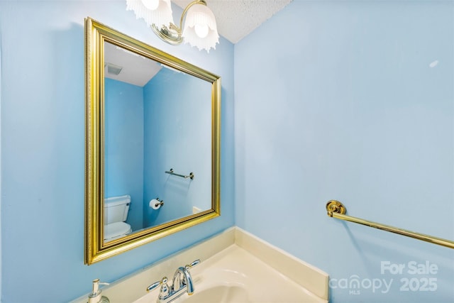 1670 Robins Nest Ct Unit D, Gastonia, NC 28054 - half bathroom featuring a textured ceiling and vanity
