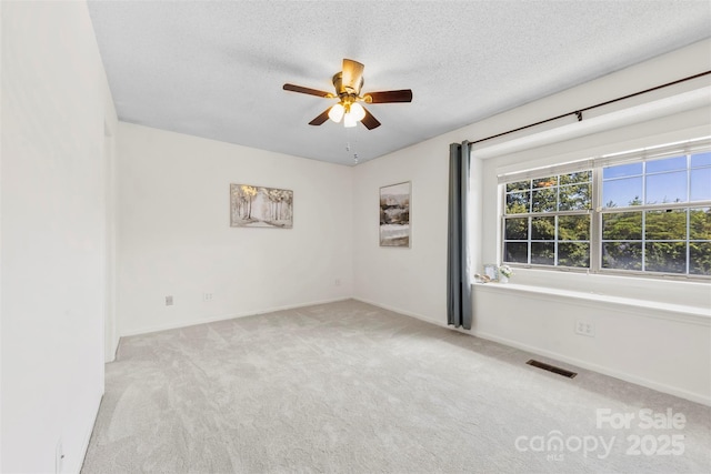 1670 Robins Nest Ct Unit D, Gastonia, NC 28054 - spare room with carpet, a ceiling fan, and a textured ceiling