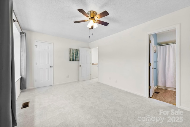 1670 Robins Nest Ct Unit D, Gastonia, NC 28054 - unfurnished bedroom with light colored carpet, a textured ceiling, and a ceiling fan