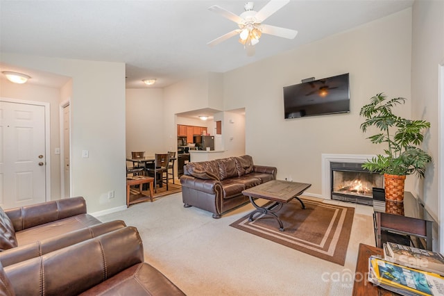 8119 Tremaine Ct Unit E, Charlotte, NC 28227 - carpeted living room featuring ceiling fan and a lit fireplace