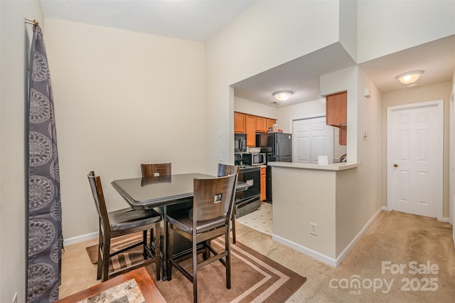 8119 Tremaine Ct Unit E, Charlotte, NC 28227 - dining room featuring baseboards and light colored carpet