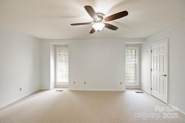55 Diamond Ridge Ln, Columbus, NC 28722 - carpeted empty room featuring ceiling fan, healthy amount of natural light, and a textured ceiling