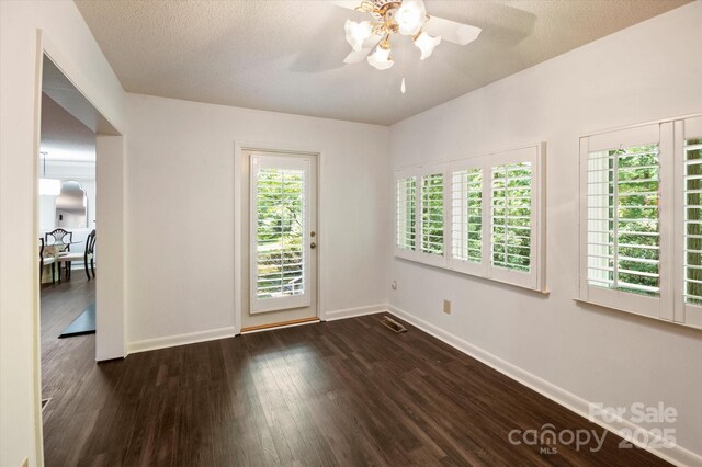 55 Diamond Ridge Ln, Columbus, NC 28722 - unfurnished room featuring a ceiling fan and dark wood-type flooring