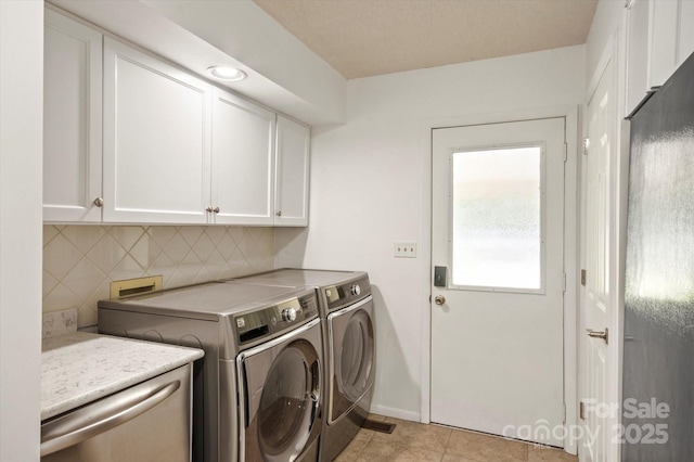 55 Diamond Ridge Ln, Columbus, NC 28722 - laundry room with cabinet space, washer and clothes dryer, and light tile patterned floors