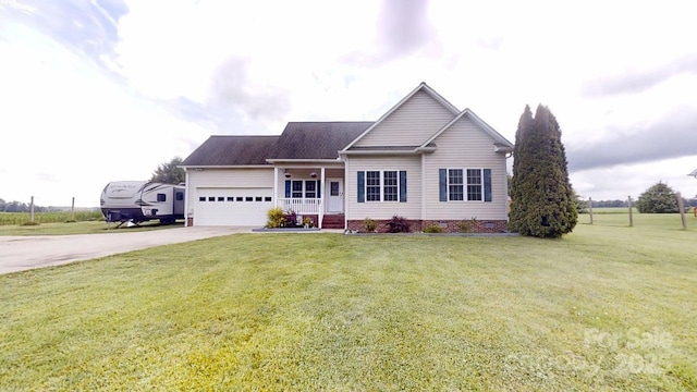 6825 Woodleaf Rd, Woodleaf, NC 27054 - ranch-style home featuring concrete driveway, an attached garage, a front lawn, and covered porch