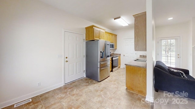 6825 Woodleaf Rd, Woodleaf, NC 27054 - kitchen with appliances with stainless steel finishes and a sink