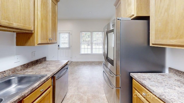 6825 Woodleaf Rd, Woodleaf, NC 27054 - kitchen featuring appliances with stainless steel finishes, light brown cabinets, and light tile patterned floors