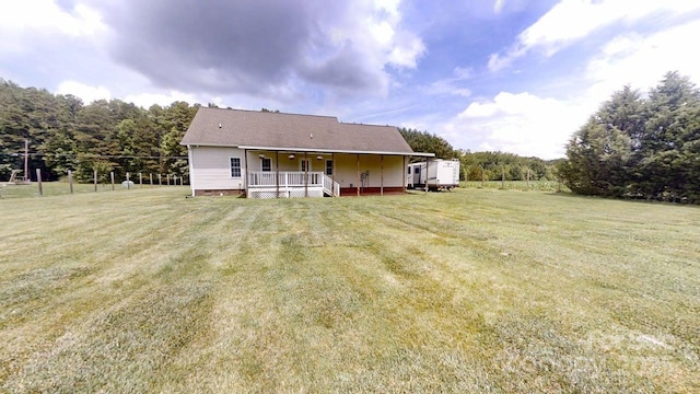 6825 Woodleaf Rd, Woodleaf, NC 27054 - back of property with a yard and covered porch