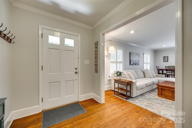 7026 Tabor Ln, Charlotte, NC 28211 - entryway with wood finished floors, crown molding, and recessed lighting