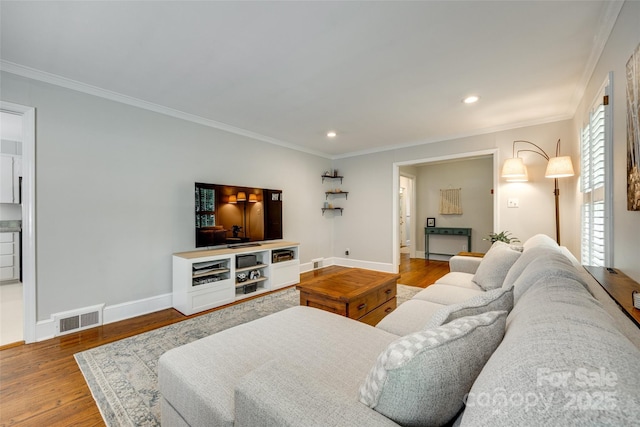 7026 Tabor Ln, Charlotte, NC 28211 - living room with ornamental molding, wood finished floors, and recessed lighting
