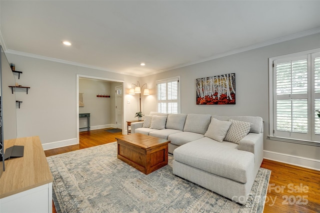7026 Tabor Ln, Charlotte, NC 28211 - living room featuring healthy amount of natural light, ornamental molding, wood finished floors, and recessed lighting
