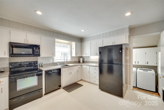 7026 Tabor Ln, Charlotte, NC 28211 - kitchen with black appliances, washer and clothes dryer, light countertops, white cabinets, and recessed lighting