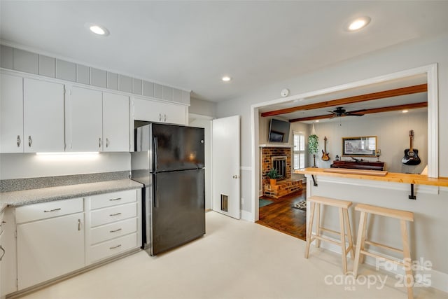 7026 Tabor Ln, Charlotte, NC 28211 - kitchen featuring freestanding refrigerator, recessed lighting, white cabinetry, and a ceiling fan