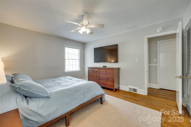 7026 Tabor Ln, Charlotte, NC 28211 - bedroom with wood finished floors and a ceiling fan