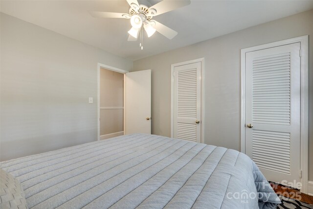7026 Tabor Ln, Charlotte, NC 28211 - bedroom with two closets and a ceiling fan