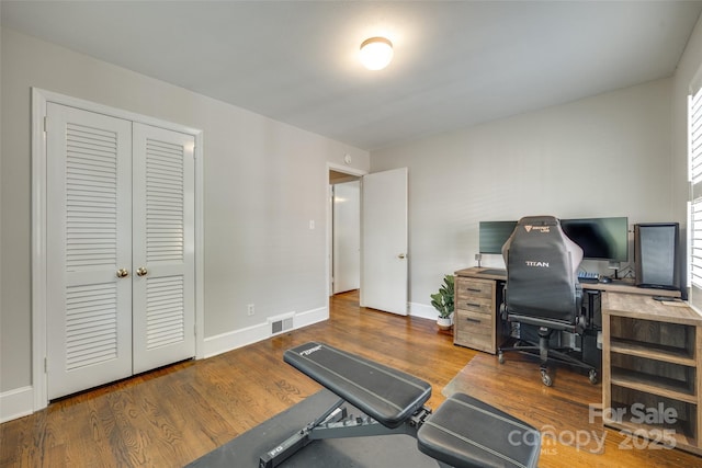 7026 Tabor Ln, Charlotte, NC 28211 - exercise area with wood finished floors and baseboards