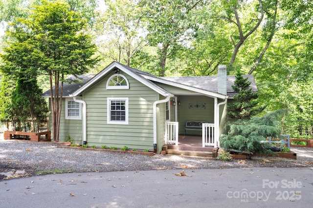 5 Arbutus Rd, Asheville, NC 28805 - view of front of house featuring a porch, a chimney, and roof with shingles