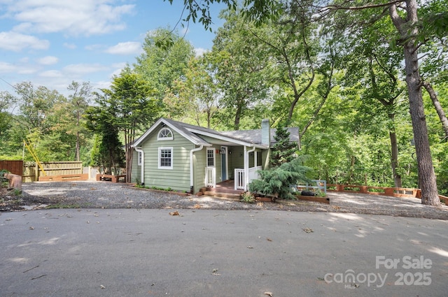 5 Arbutus Rd, Asheville, NC 28805 - bungalow-style house with view of wooded area