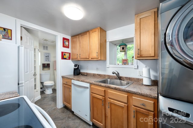 5 Arbutus Rd, Asheville, NC 28805 - kitchen with white appliances, washer / dryer, and dark tile patterned flooring