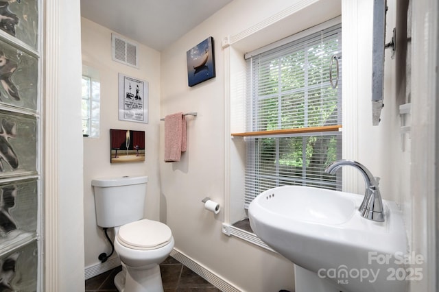 5 Arbutus Rd, Asheville, NC 28805 - bathroom featuring baseboards and tile patterned flooring