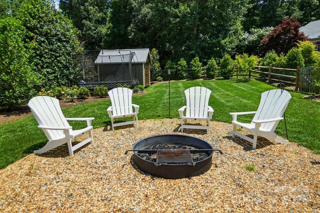 7903 Tottenham Ct, Waxhaw, NC 28173 - view of yard featuring an outdoor fire pit and a storage unit