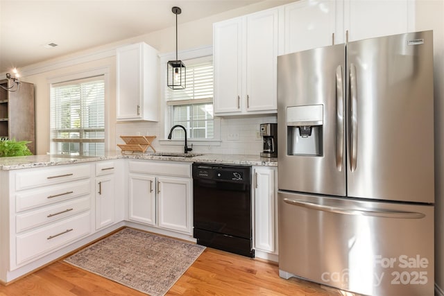7344 Gilead Rd, Huntersville, NC 28078 - kitchen with stainless steel refrigerator with ice dispenser, black dishwasher, plenty of natural light, and white cabinetry