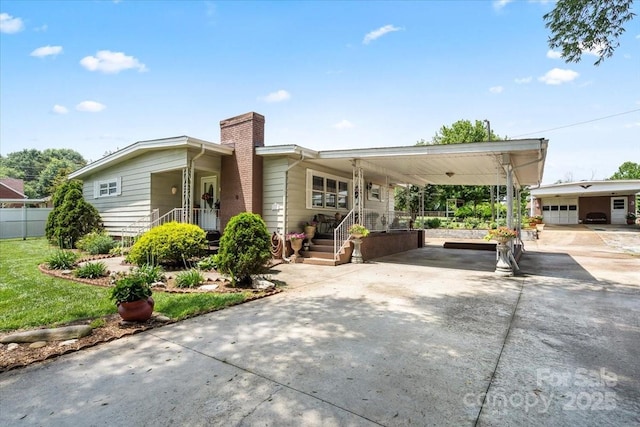 1627 33rd Ave NE, Hickory, NC 28601 - view of front of home featuring a chimney, driveway, and a garage