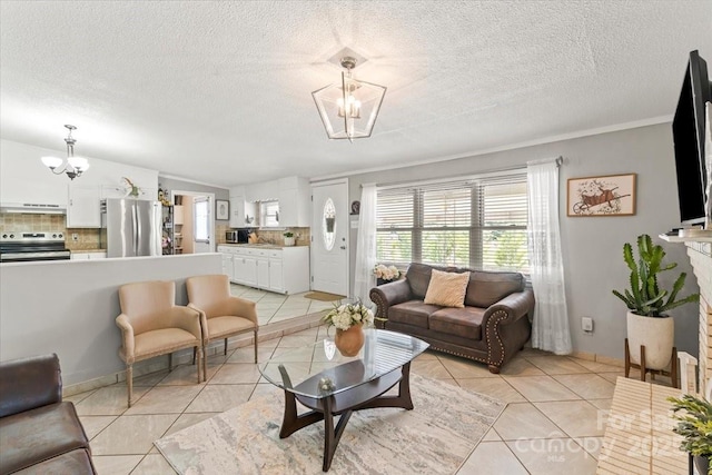 1627 33rd Ave NE, Hickory, NC 28601 - living room featuring a chandelier, light tile patterned flooring, a textured ceiling, and vaulted ceiling