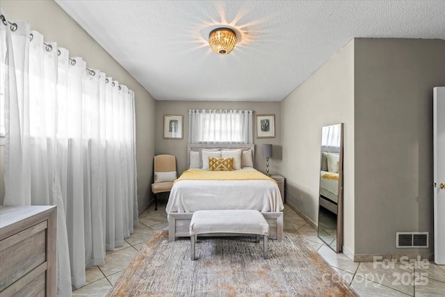1627 33rd Ave NE, Hickory, NC 28601 - bedroom featuring light tile patterned floors and a textured ceiling