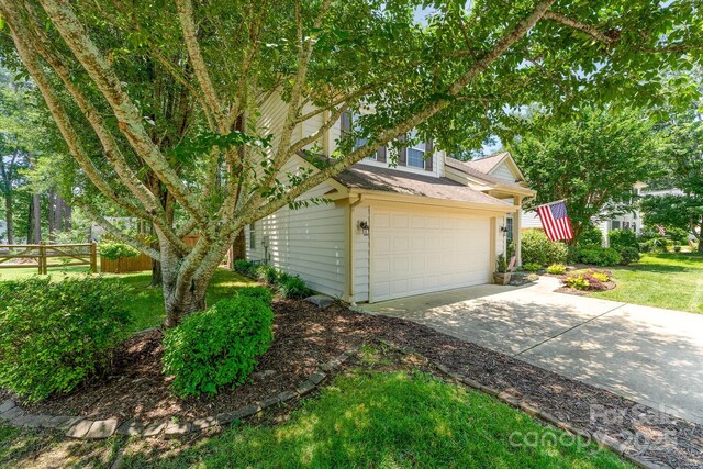 8701 Appaloosa Way Ln, Charlotte, NC 28216 - view of side of home with driveway and roof with shingles