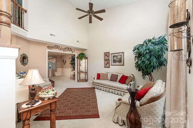 8701 Appaloosa Way Ln, Charlotte, NC 28216 - carpeted living room with a ceiling fan and high vaulted ceiling