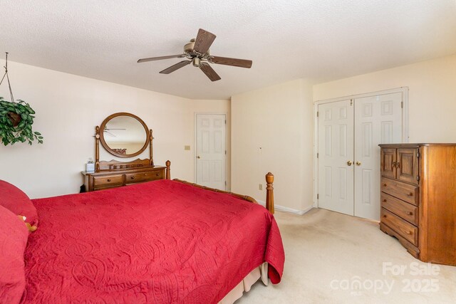 8701 Appaloosa Way Ln, Charlotte, NC 28216 - bedroom featuring light carpet, a ceiling fan, and a closet
