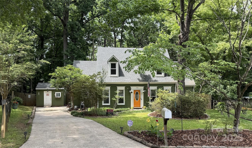 7639 Winterset Dr, Charlotte, NC 28270 - cape cod home with concrete driveway, a front yard, and roof with shingles